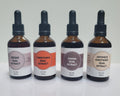 Four bottles of dual extract on a white background